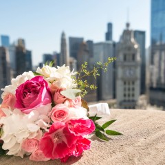 wedding bouquet against Chicago skyline